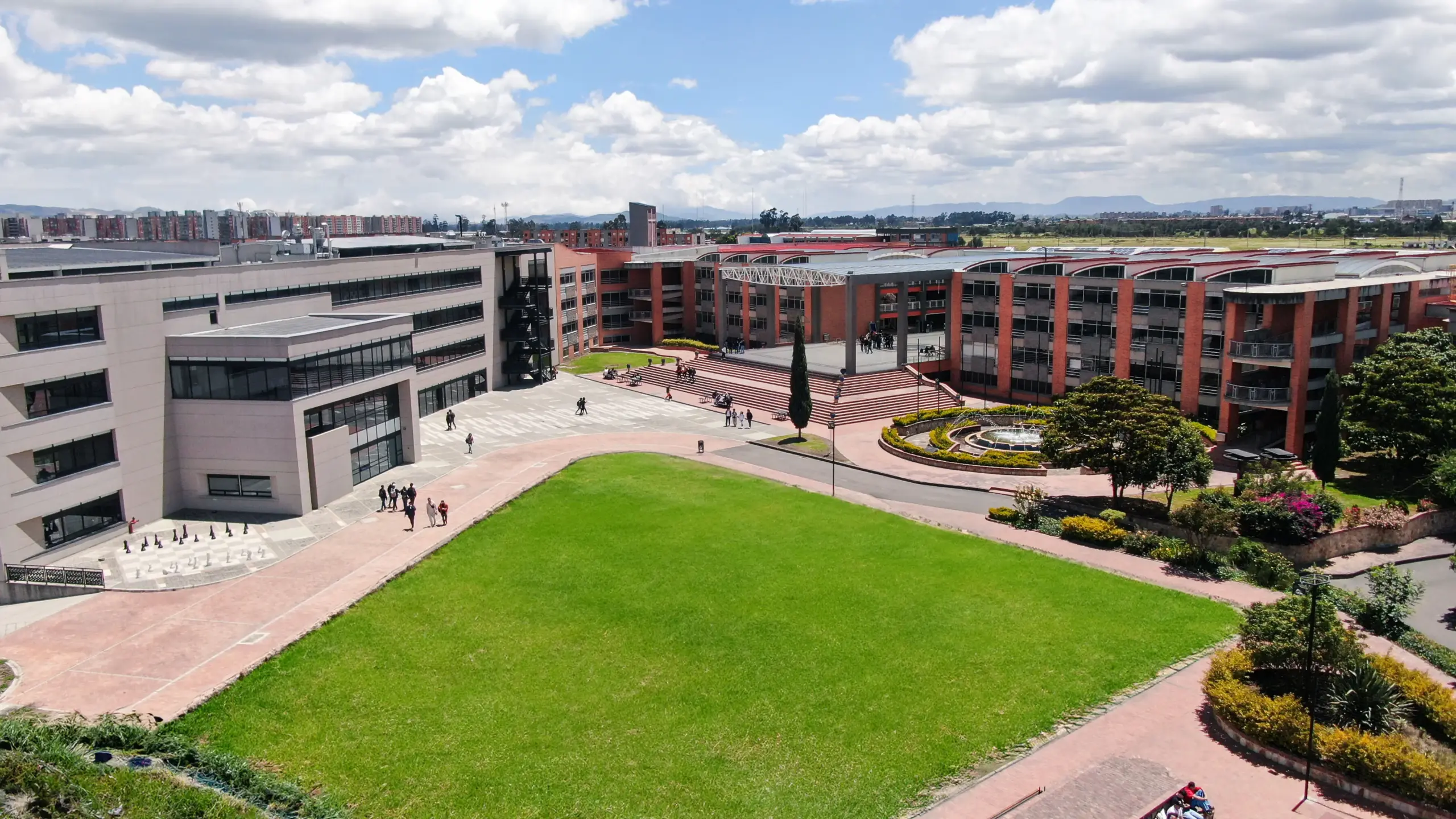 Modern university campus building with students